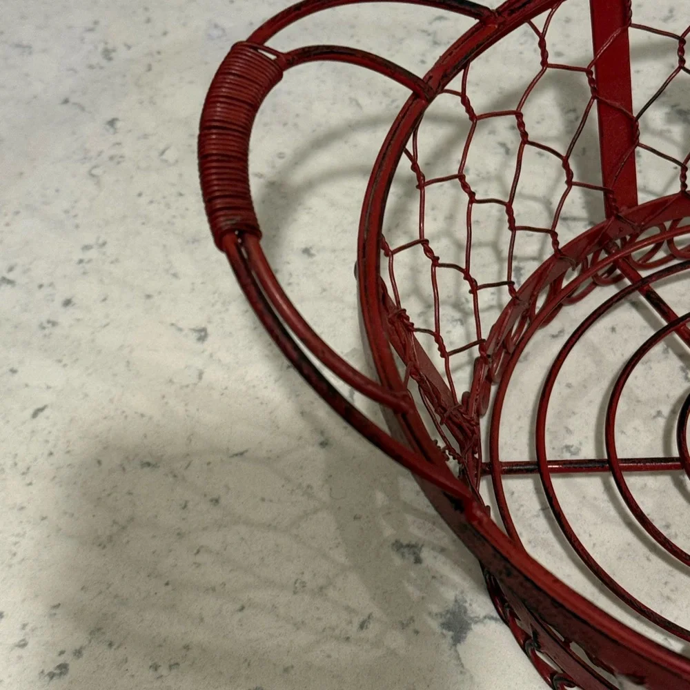 Red Rooster red wired metal basket approximately 7” diameter